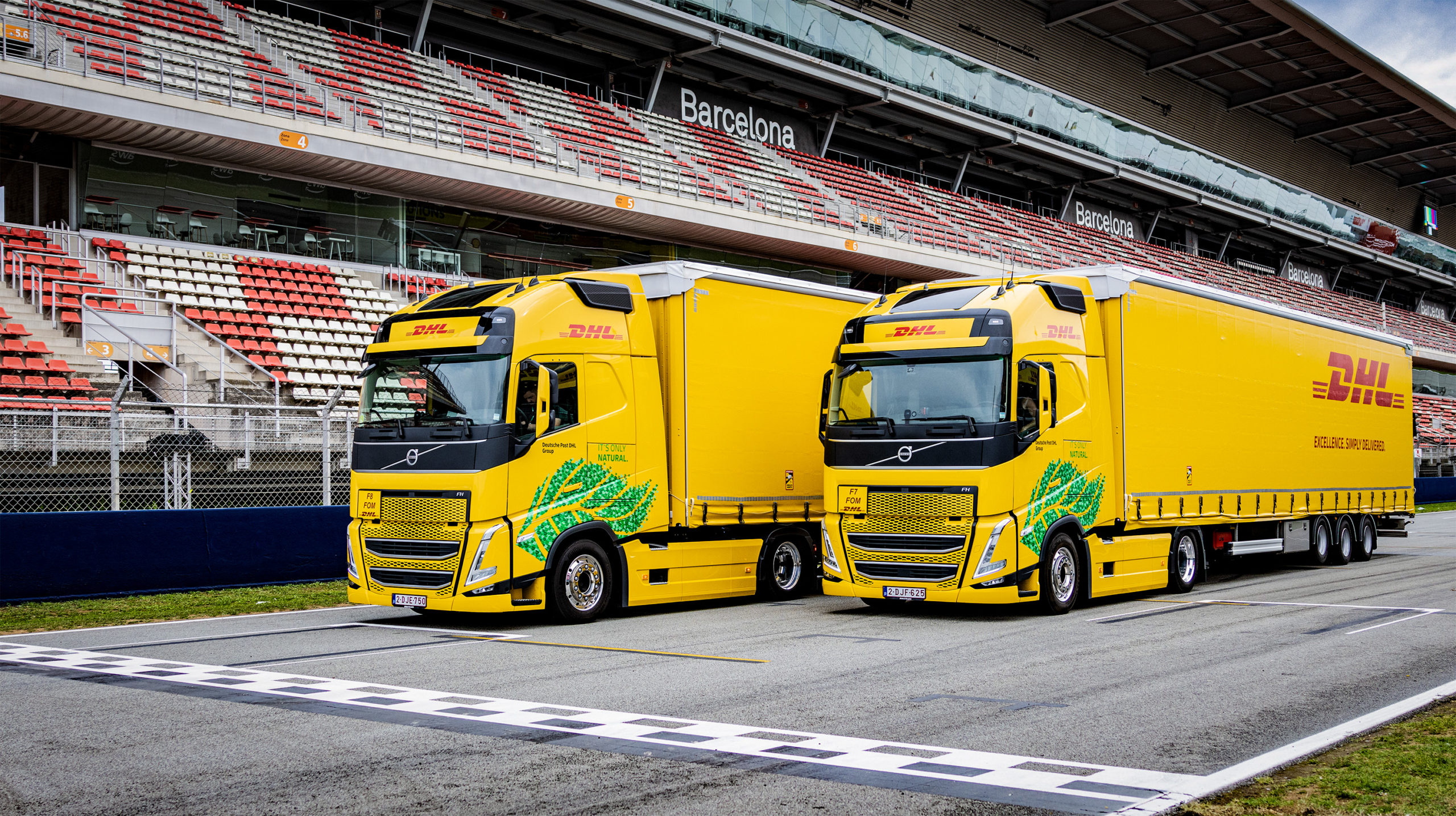 DHL добавляет 18 новых грузовиков, работающих на биотопливе, для доставки болидов Формулы 1